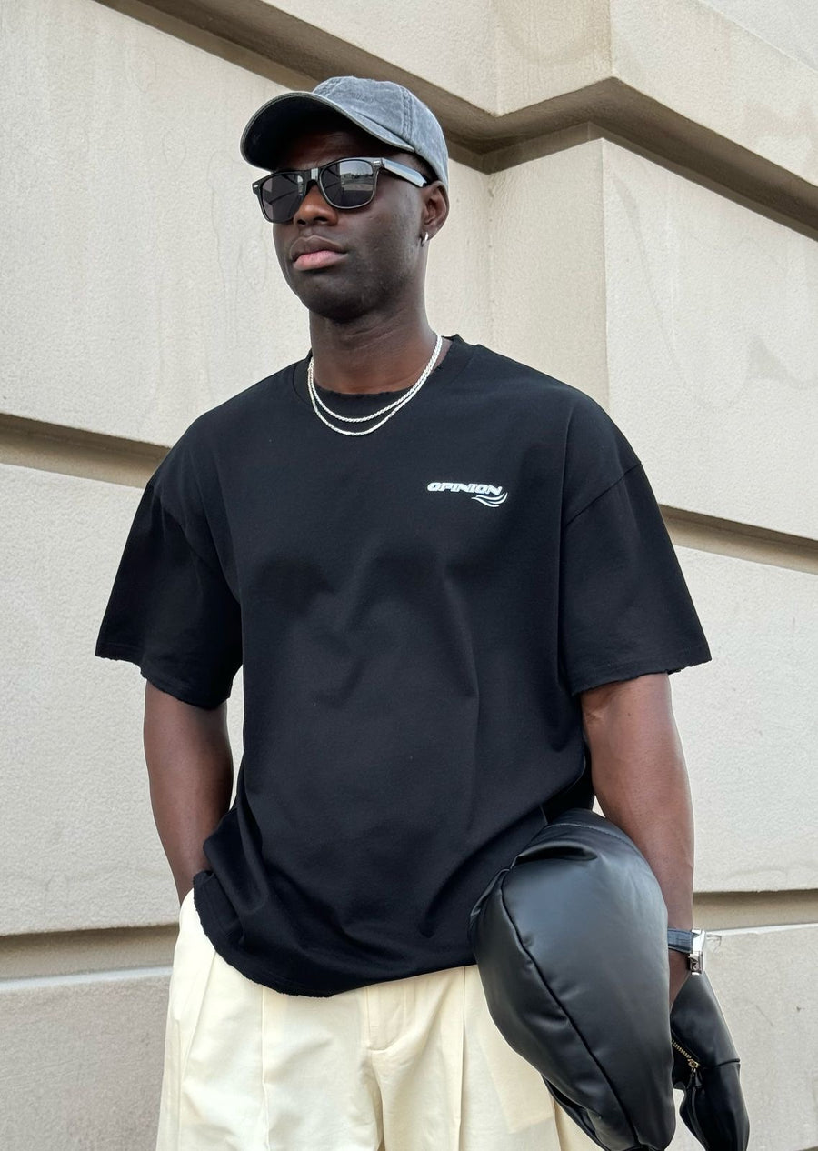 Model wearing the black Past x Future tee, front